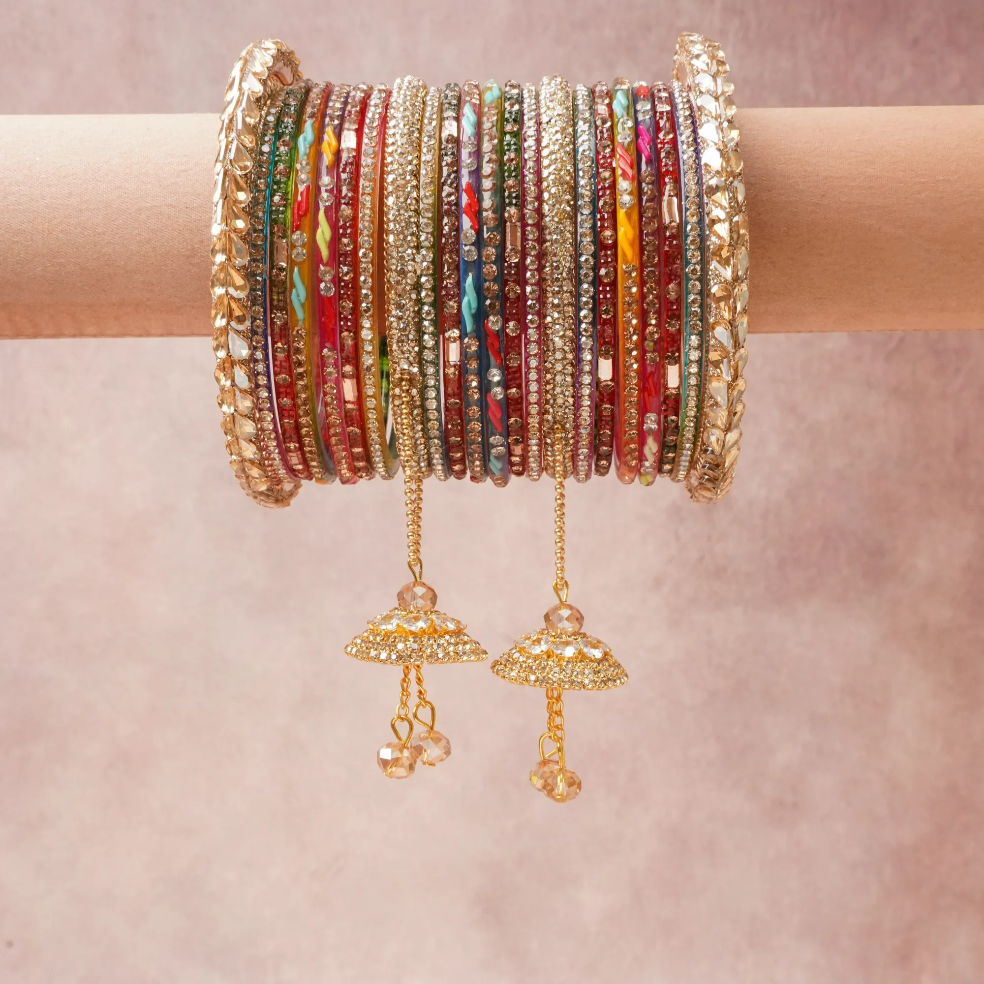 A commanding Multi colour anchors this beautiful set, enriched with accents of Deep Red, Teal Blue, Fuchsia Pink, Emerald Green, Orange, Purple that add depth and dimension.

Featuring a striking composition of Gold-toned Metal, Glass, Crystal, Silk Thread, Acrylic, this set carries intricate craftsmanship and strong presence. Grand in form, it is created for moments that deserve to be marked.